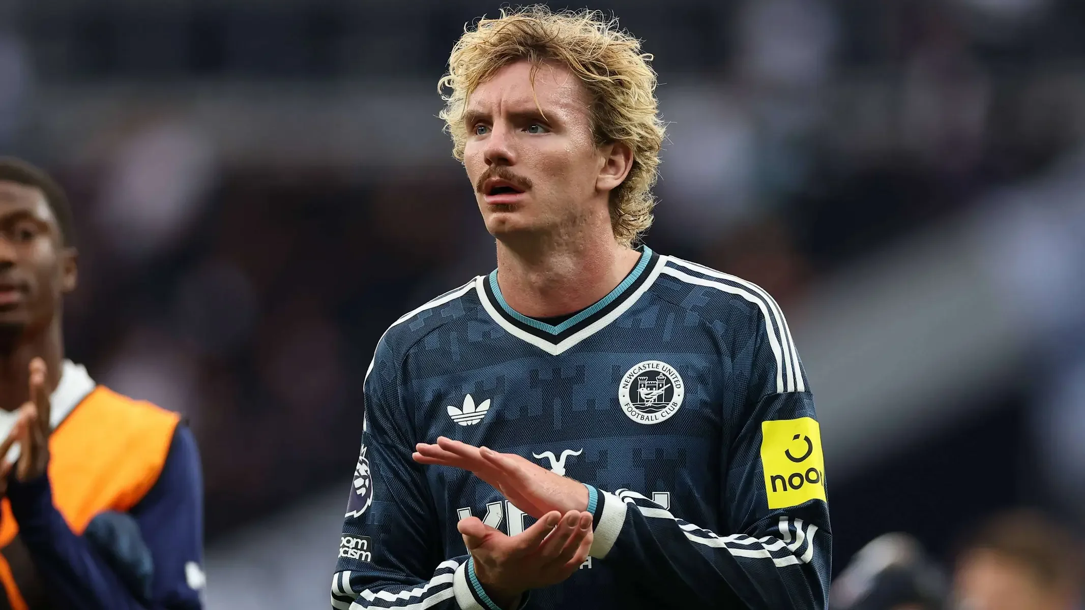 Nick Woltemade wearing a dark blue Newcastle United jersey during a match