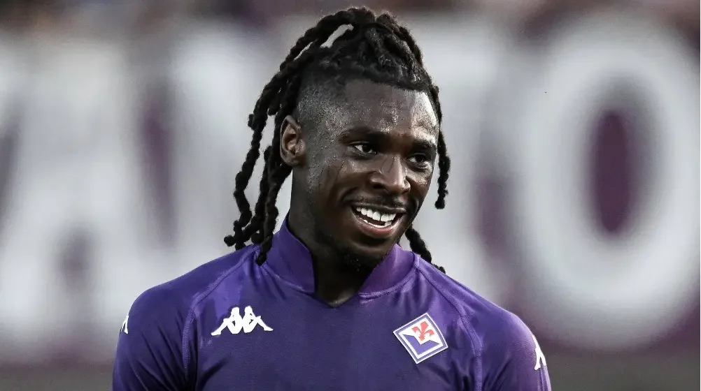 Moise Kean wearing a purple ACF Fiorentina jersey