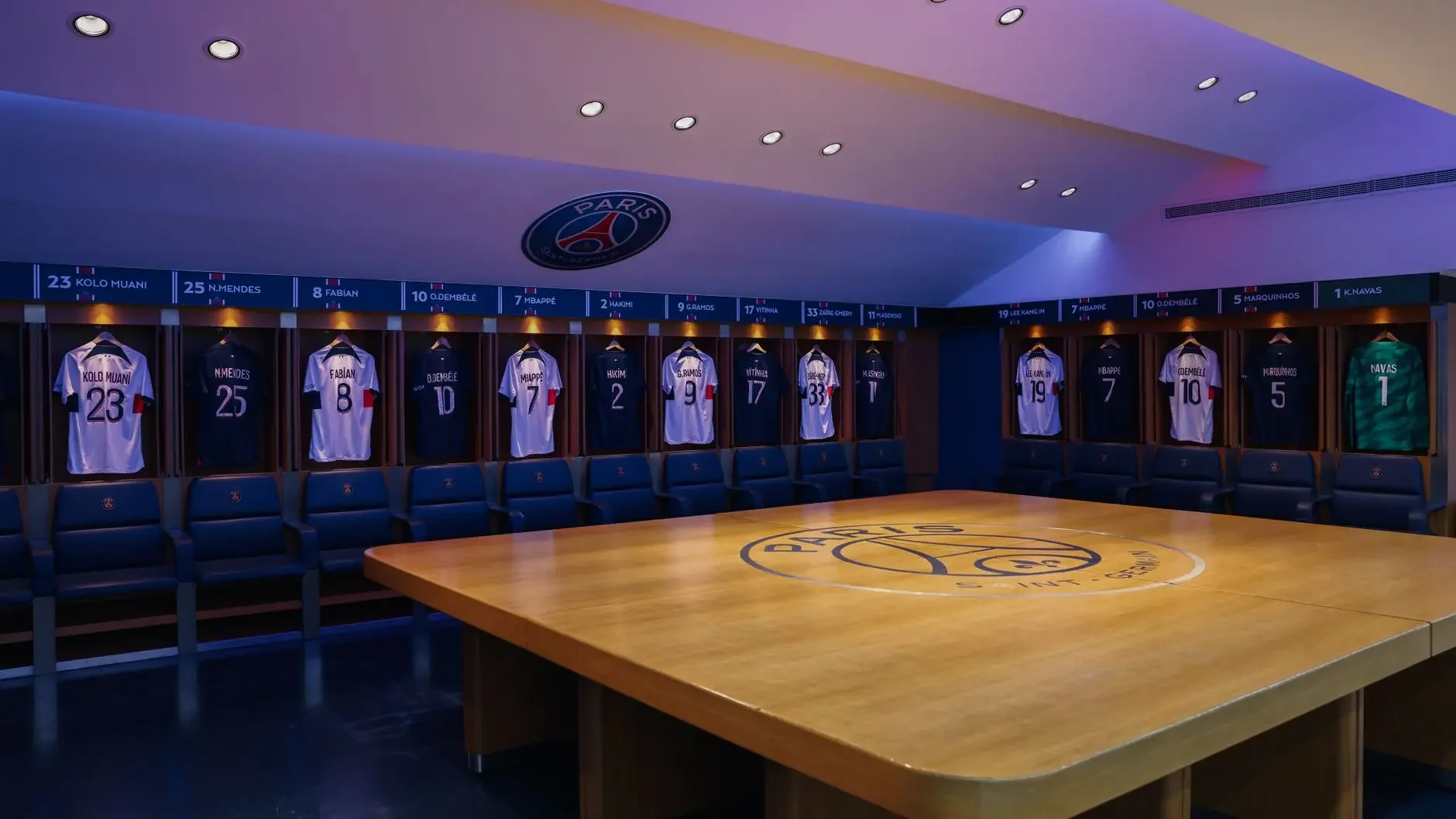 PSG locker room featuring Randal Kolo Muani's number 23 jersey hanging on a locker